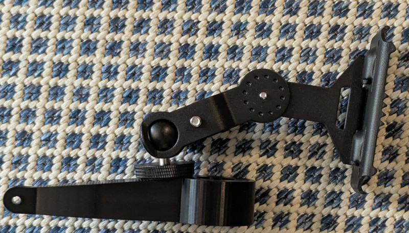 A photo of a game camera mount attached to 3d printed mount